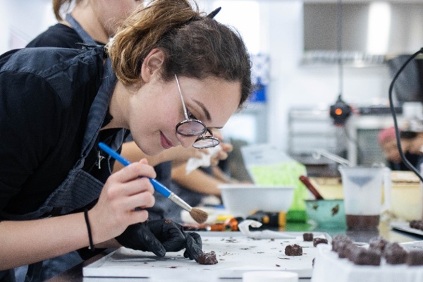 pastry student decorating chocolates